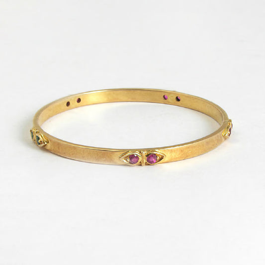 The Babyrasa Urmi Gold, Ruby and Emerald Bangle by Rasvihar