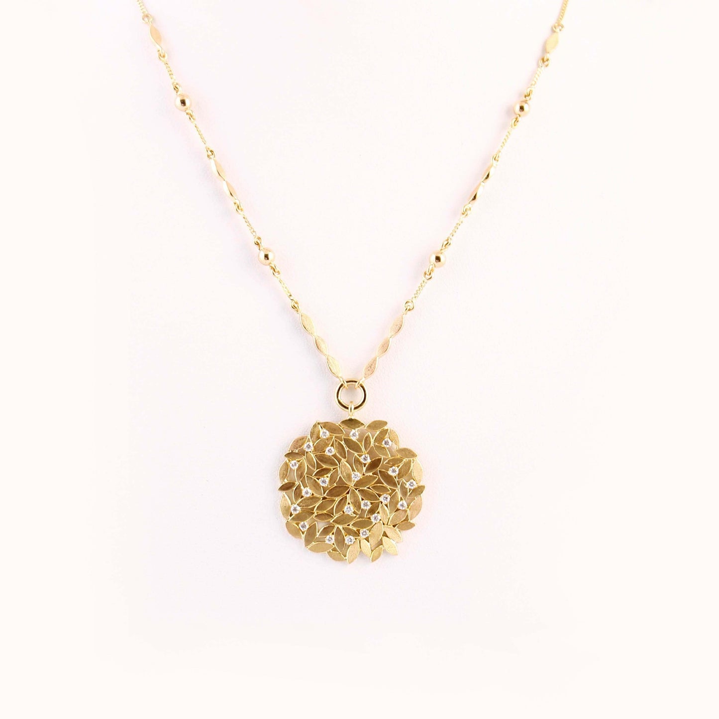 The Dhanashri Leaf Series Gold and Diamond Pendant by Rasvihar