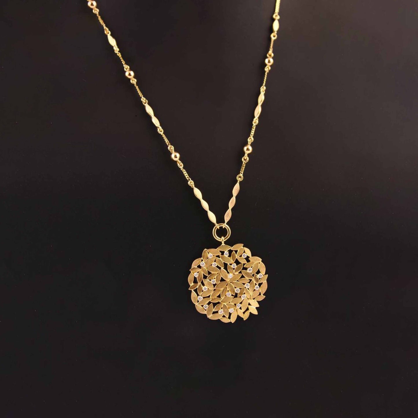The Dhanashri Leaf Series Gold and Diamond Pendant by Rasvihar