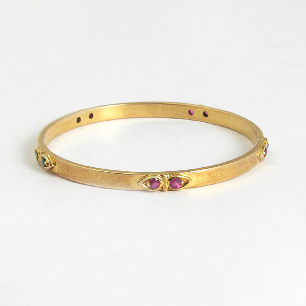 The Babyrasa Urmi Gold, Ruby and Emerald Bangle by Rasvihar