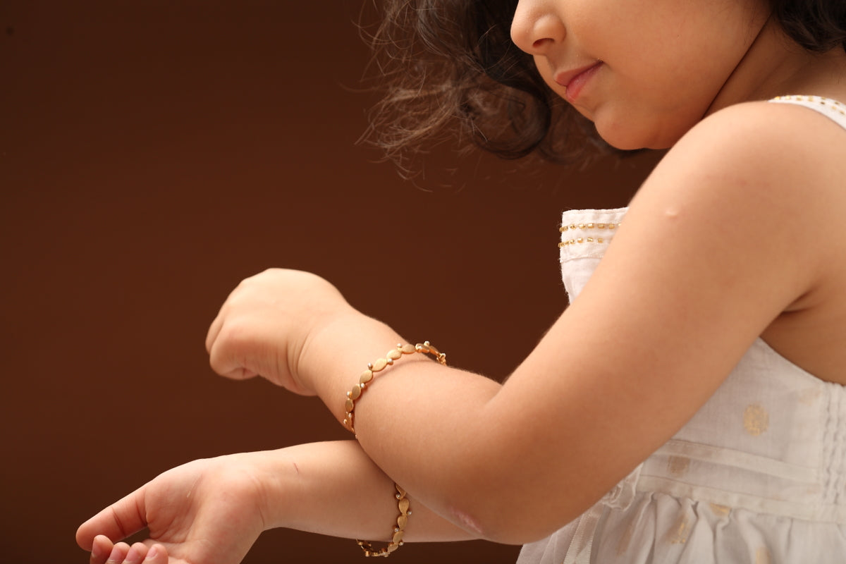 The Babyrasa Padma Paisley Gold and Pearl Bangle by Rasvihar