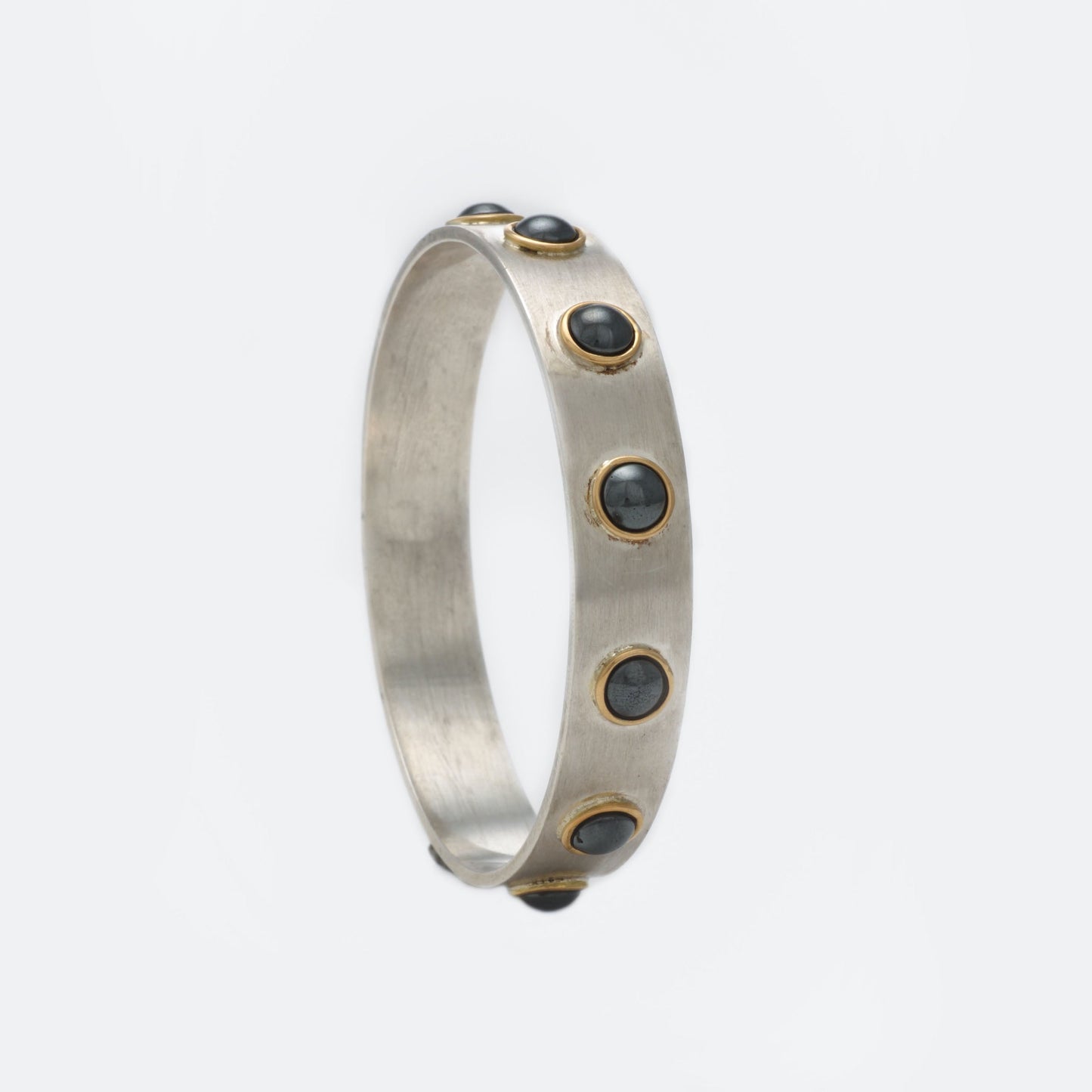 The Sandhya SiGo Silver Gold and Hematite Bangle by Rasvihar