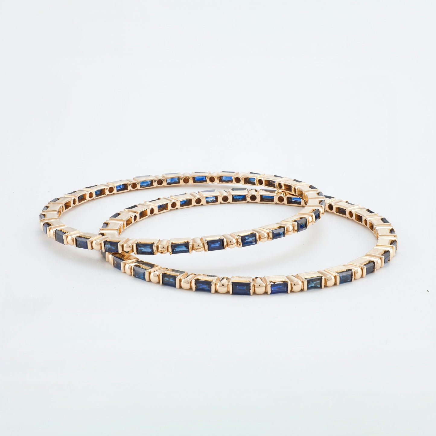 The Avantika Gold and Blue Sapphire Bangle by Rasvihar